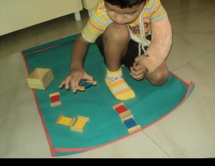 A child at work with the colour tablets